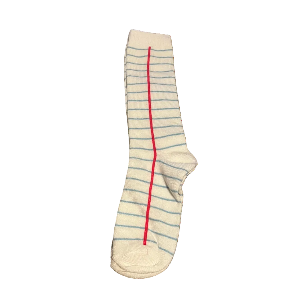 Girls knee-high socks with notebook paper design featuring blue lines and red margin, perfect for school outfits or back-to-school style. notebook knee high socks, notebook paper knee high socks