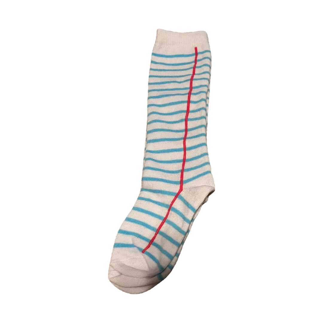 Girls knee-high socks with notebook paper design featuring blue lines and red margin, perfect for school outfits or back-to-school style. notebook knee high socks, notebook paper knee high socks