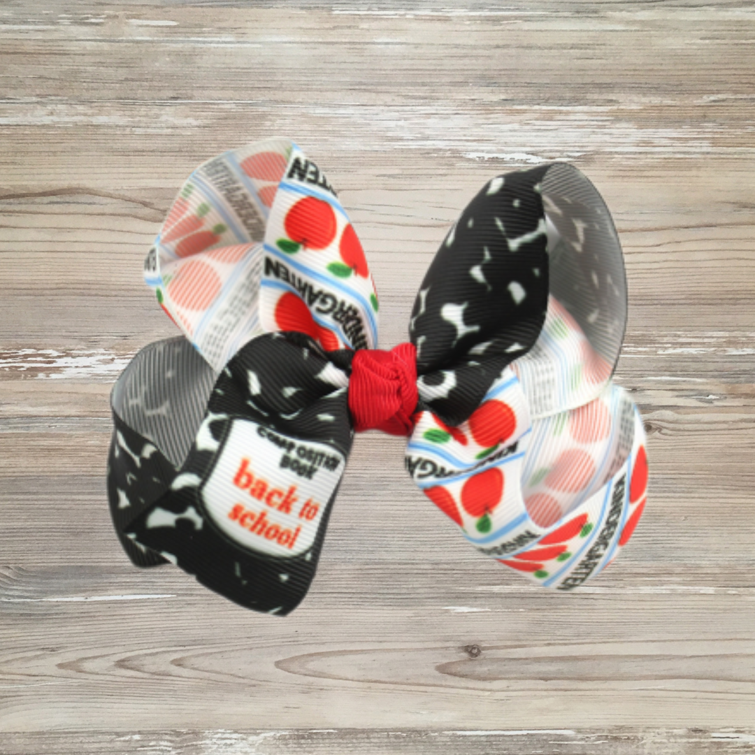 Colorful kids back-to-school bow with apples, notebook paper, and black composition print, red accented Colorful kids back-to-school bow with apples, notebook paper, and black composition print, grosgrain ribbon bow, girls back to school hair clip