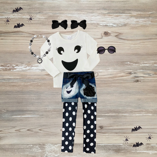 Trendy girls Halloween outfit with smiling ghost shirt, sparkly patch denim shorts, and black-and-white polka dot leggings, cute ghost outfit kids boutique , Halloween-themed girls clothing set with ghost print shirt, happy ghost,