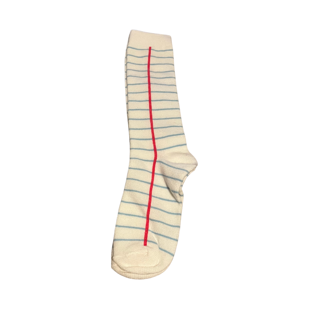 Girls knee-high socks with notebook paper design featuring blue lines and red margin, perfect for school outfits or back-to-school style. notebook knee high socks, notebook paper knee high socks