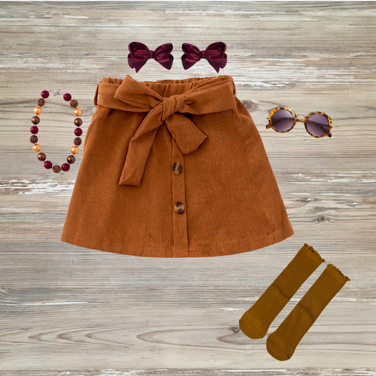 Pumpkin spice corduroy A-line skirt with front buttons and a bow tie waistband for toddler girls, kids online boutique clothing, corduroy skirt for girls, girls boutique clothing.