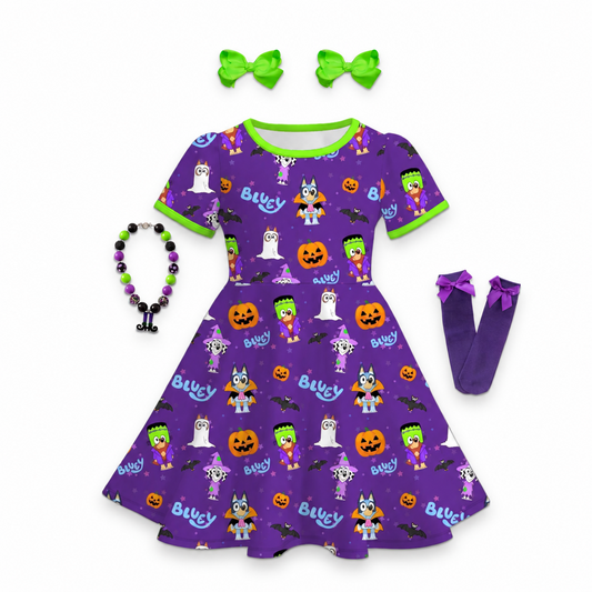 girls bluey halloween dress, bluey and bingo halloween dress, kids online boutique dresses, kids online boutique clothing, bluey and bingo dress, bluey halloween outfit, Toddler and girls short-sleeve purple Halloween A-line dress featuring costumed cartoon pups, jack-o'-lanterns, ghosts, and bright green trim, trick or treat girls outfit