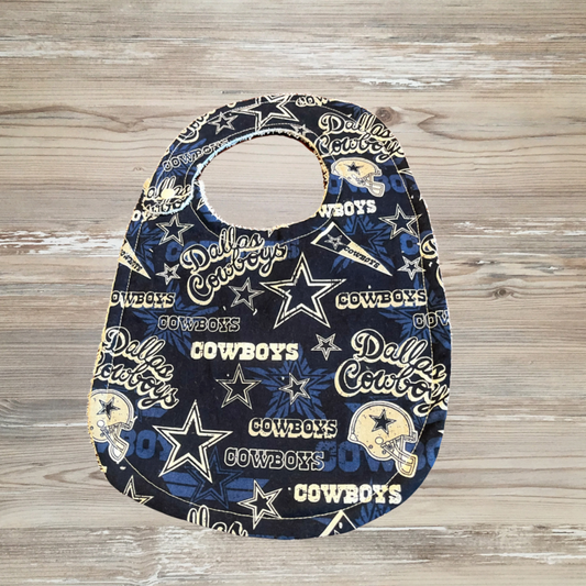 Baby bib with Dallas Cowboys pattern, Navy blue adaptive bib for children with special needs or drooling, featuring Dallas Cowboys logos, stars, and football helmets