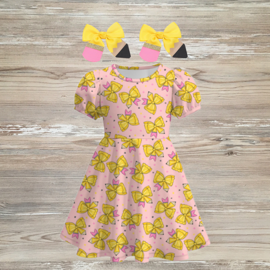 Pink coquet-style girls dress with yellow pencil-themed bows and pink stars, short sleeves, and matching yellow pencil hair bows – perfect for back-to-school outfits, pencil coquet bow girls dress