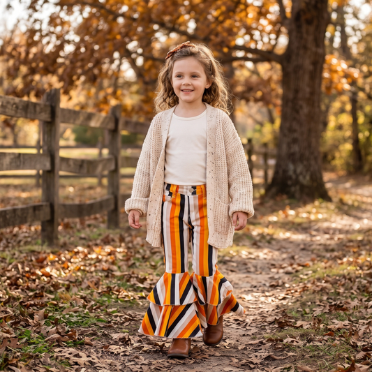 Girls orange, yellow, and black striped tiered ruffle bell bottom jeans for fall and Halloween, Toddler girls candy corn stripe flare jeans featuring double tiered ruffle hem, kids online boutique jeans, girls jeans for fall, kids boutique clothing