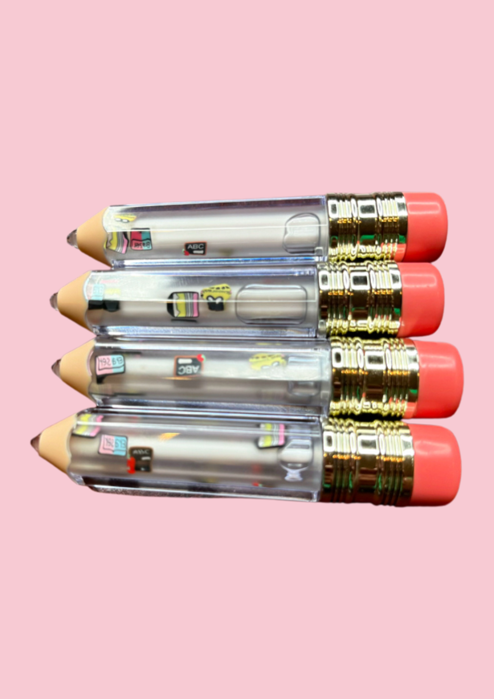 School Days' lip gloss tubes shaped like pencils with red eraser tops, featuring mini school-themed charms inside such as books, calculators, and buses. kid's lip gloss for girls, teacher appreciation gift, lip gloss for school gifts, stocking stuffers